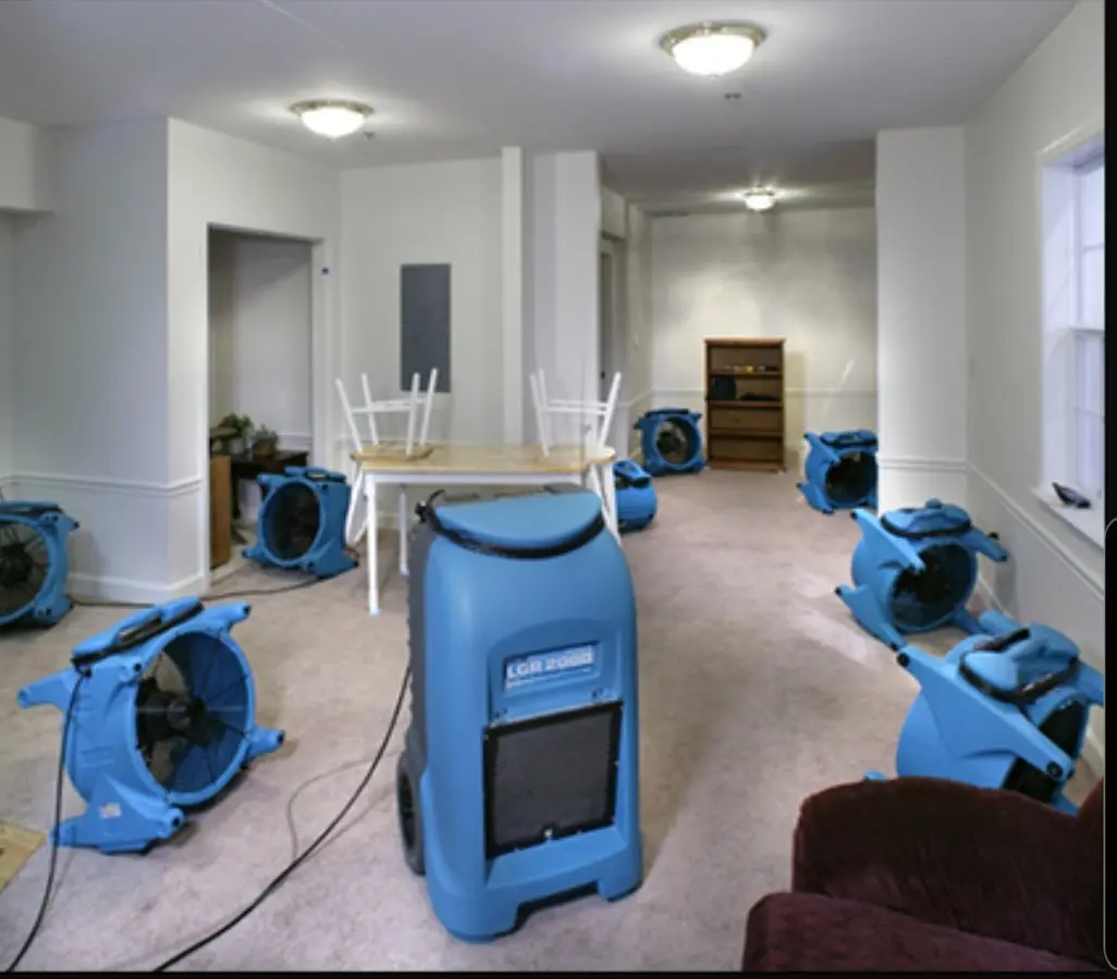 Air movers and dehumidifier setup for Water Damage Restoration in Nashua